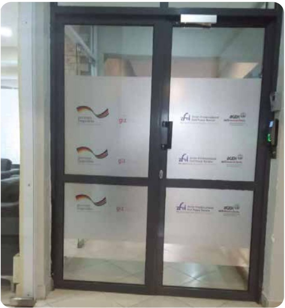 Frosted glass door branding — GIZ offices